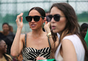 Meghan, Duchess of Sussex adjusts her glasses on the day she and Britain's Prince Harry, Duke of Sussex attend a volleyball match played with wounded army veterans, at the Nigerian army officers' mess in Abuja, Nigeria May 11, 2024.