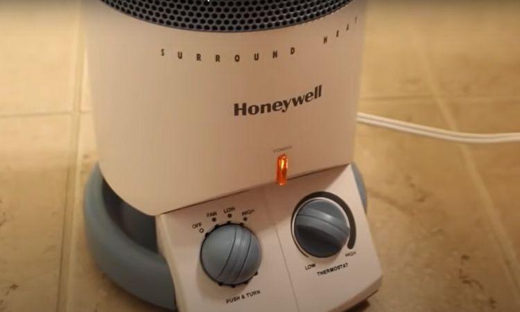 place the small, powerful heater under the kitchen or vanity base cabinet