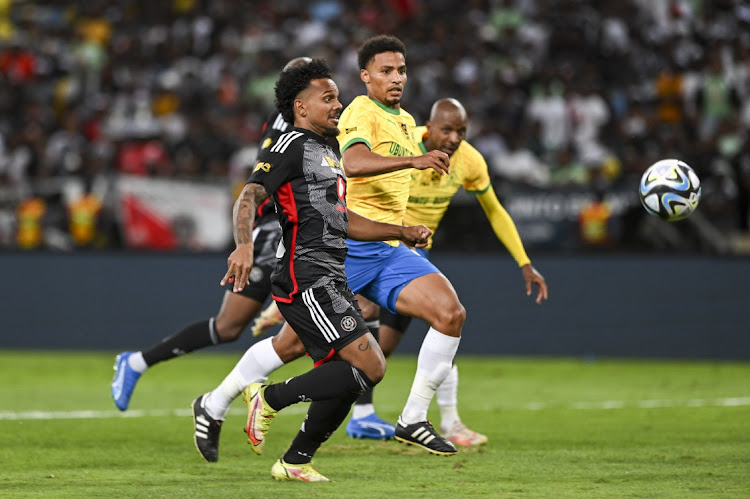 Orlando Pirates' Kermit Romeo Erasmus and Mamelodi Sundowns' Rivaldo Coetzee during the MTN8 final match between Orlando Pirates and Mamelodi Sundowns on Saturday