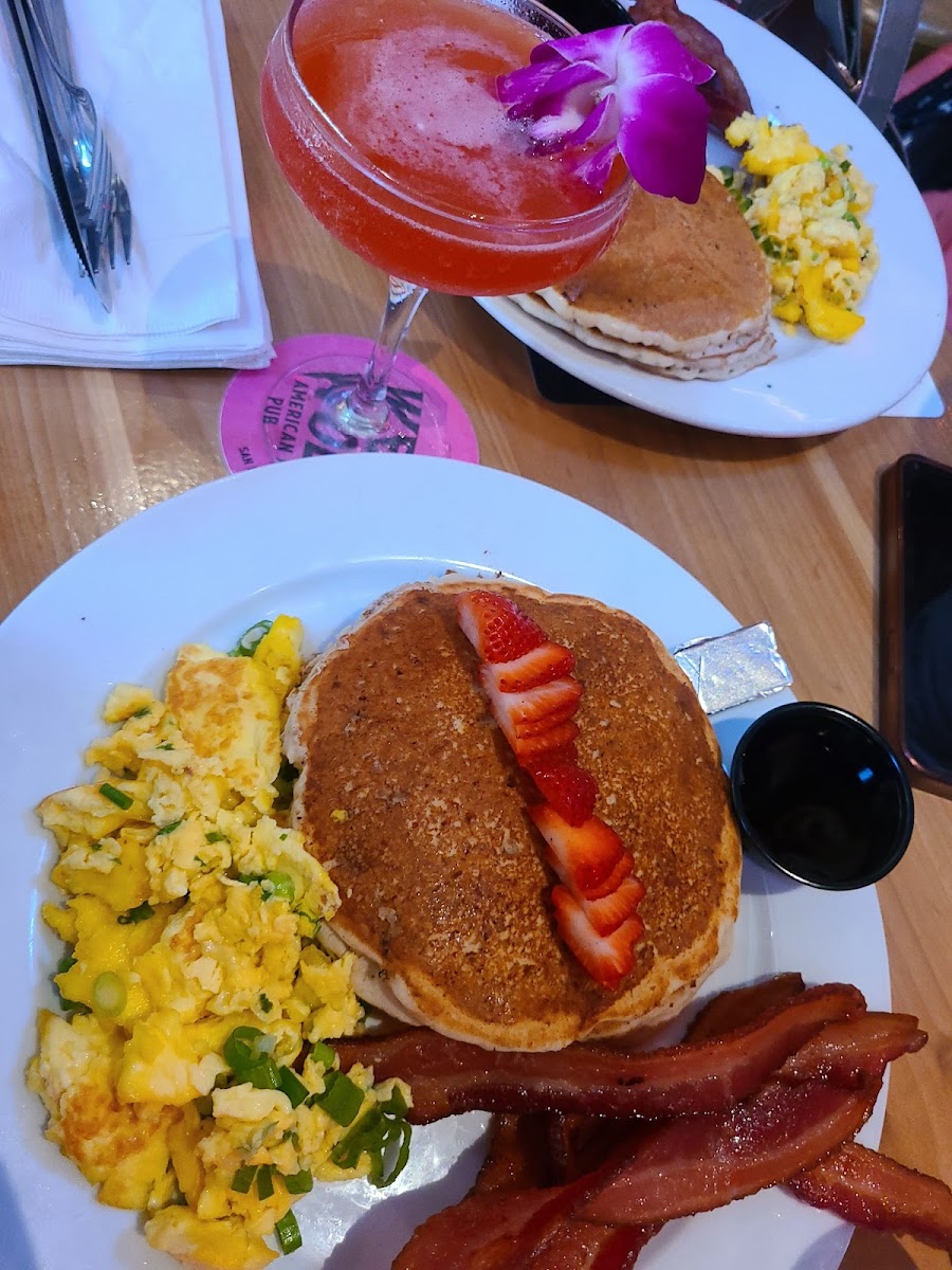 Gluten free pancakes with cheesy eggs and crispy bacon