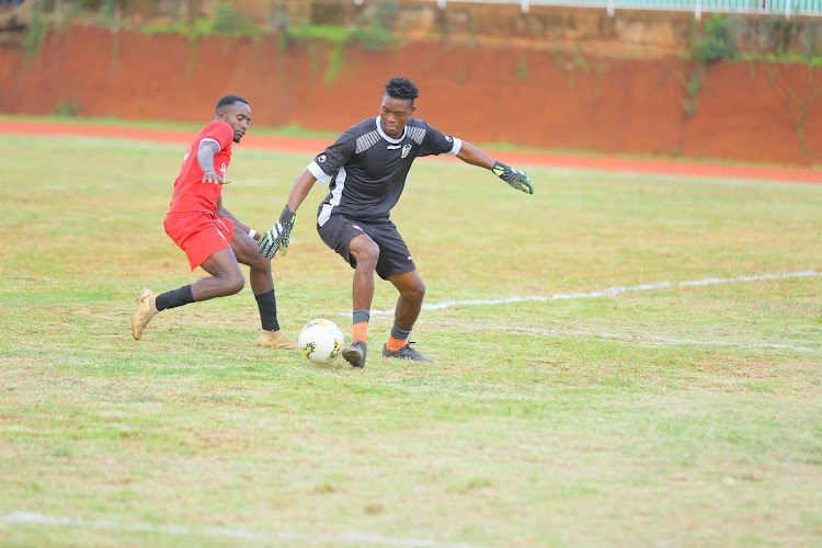 Coastal Heroes' goalkeeper Dhadho Said dribbles the ball against Shabana's Isaac Otieno at Gusii Stadium