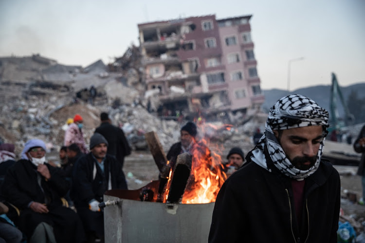 People wait for news of their families, in Hatay, Turkey. February 9 2023.