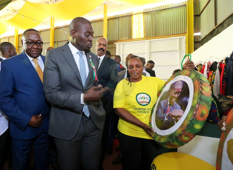 Nairobi Governor Johnson Sakaja being shown his portraits during Nairobi International Trade Fair show at Jamuhuri Park Showground on September 27, 2022.