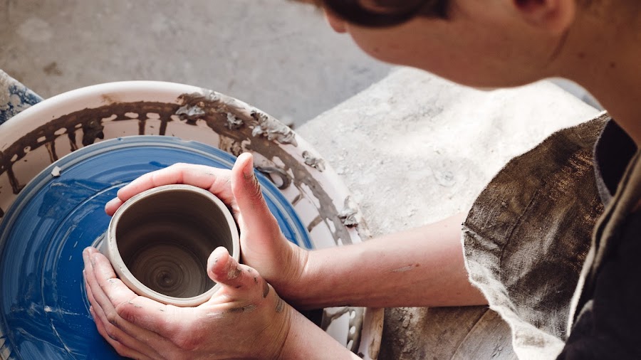 Woman opening can of paint