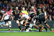 Elton Jantjies of the Emirates Lions powers through a challenge during the 23 - 17 Super Rugby win over the Chiefs in Hamilton, New Zealand, on April 19 2019. 