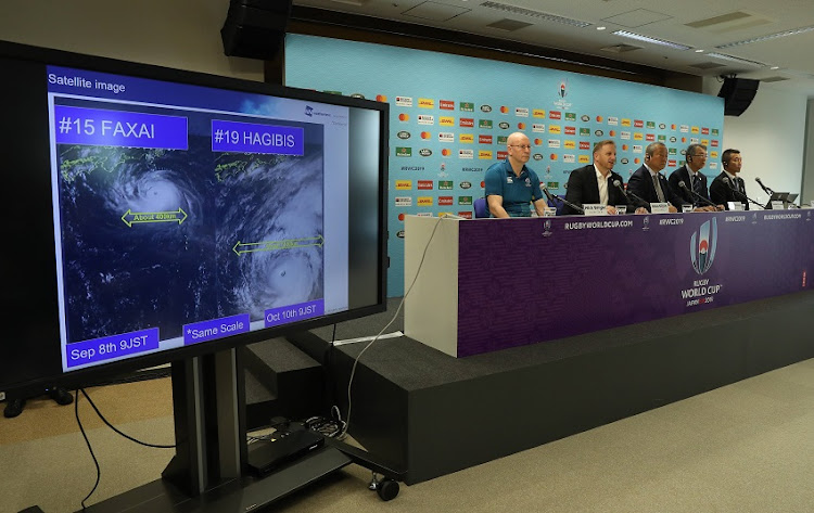 Rugby World Cup tournament chiefs demonstrate to the media, the potential impact of typhoon Hagibis as they announce match cancellations at a press conference held on October 10, 2019 in Tokyo, Japan.