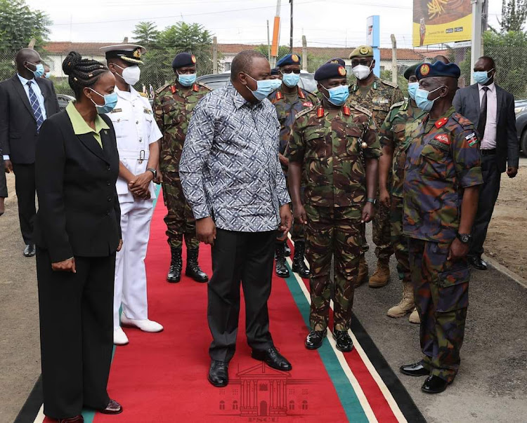 President Kenyatta talks to Brig Odhiambo (on right) when he visited the facility in December 2020