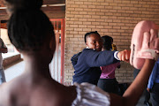 Pupils take part in a self-defence class.