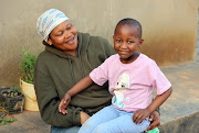 Molemo Modibogo, 5, with her mother Nkele is happy to be back home in Orange Farm, south of Johannesburg.