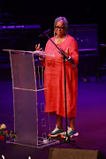 Brenda Sisane talks at the memorial service of Gloria Bosman