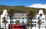 The facade of the newly renovated Winchester Hotel in the shadow of Signal Hill.