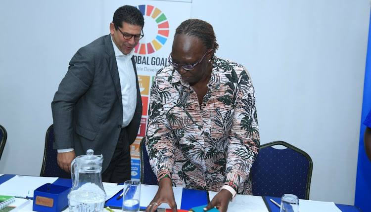 United Nations Development Programme resident representative Walid Badawi and Environment PS Betty Maina at Voyager on Tuesday.