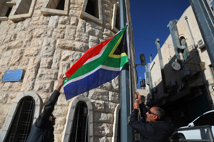 The municipality of Bethlehem raises the South African flag in front of its building to express gratitude after SA filed a case against Israel at the ICJ, in Bethlehem, West Bank, in this January 16 2024 file photo. Picture: WISAM HASHLAMOUN/ANADOLU via GETTY IMAGES