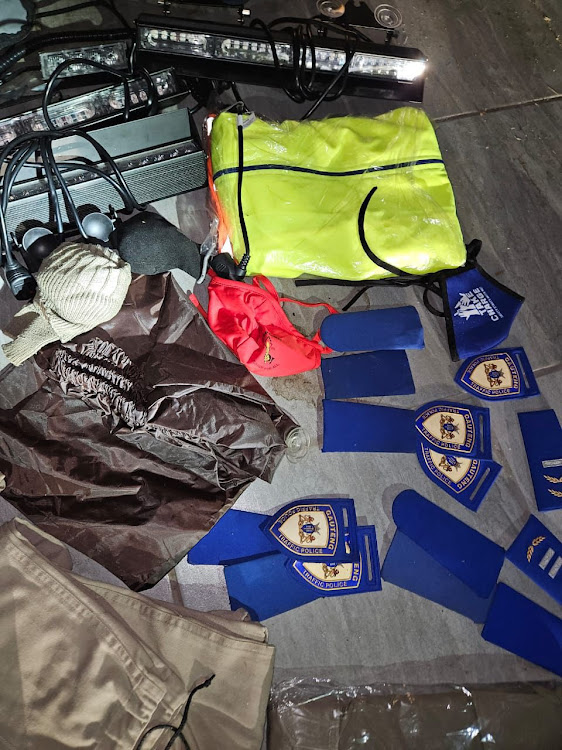 Uniforms belonging to traffic police and blue lights were seized.