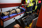 Medical services attend to injured passengers at the Lynn Ross Train station on Monday night.  File photo