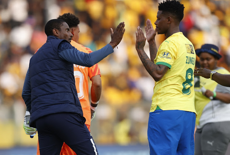 Mamelodi Sundowns coach Rulani Mokwena congratulates midfielder Bongani Zungu after their MTN8 semifinal, second leg win against Kaizer Chiefs at Lucas Moripe Stadium on Saturday.