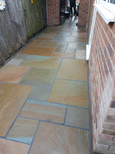 Buff rippon patio finished of with grey pointing 