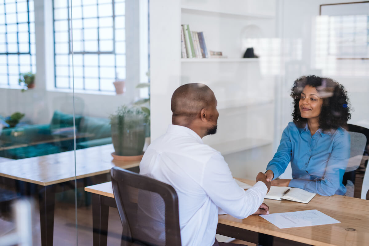 FMLA tracking: manager shaking hands with an employee