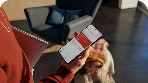 Woman receiving message to reset password on her device