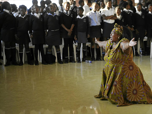 GRIEF STRICKEN: A poignant moment at the memorial service for 18 pupils and two adults killed in a taxi crash near Bronkhorstspruit