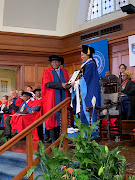 Kaizer Motaung receives his honorary doctor of social science degree from UCT.