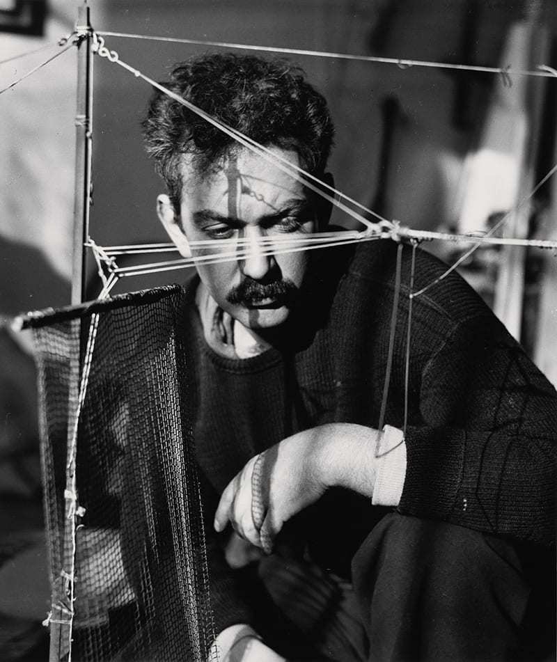 Alexander Calder photographed in Paris, 1929, by Hungarian photographer André Kertész.