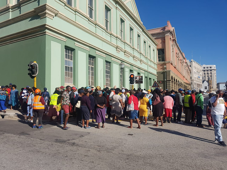 SMMEs have gathered outside the Woolboard Exchange building where a meeting to decide Mongameli Bobani's fate has been cancelled