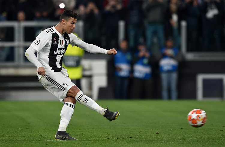 Cristiano Ronaldo of Juventus scores penalty during the UEFA Champions League - Round of 16, Second Leg match between Juventus and Atletico Madrid at Allianz Stadium on March 12, 2019 in Turin, Italy.