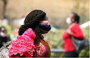 A woman wears a protective face mask following the closure of Wuse market for failing to adhere to coronavirus disease  prevention protocols in Abuja, Nigeria on February 2 2021.
