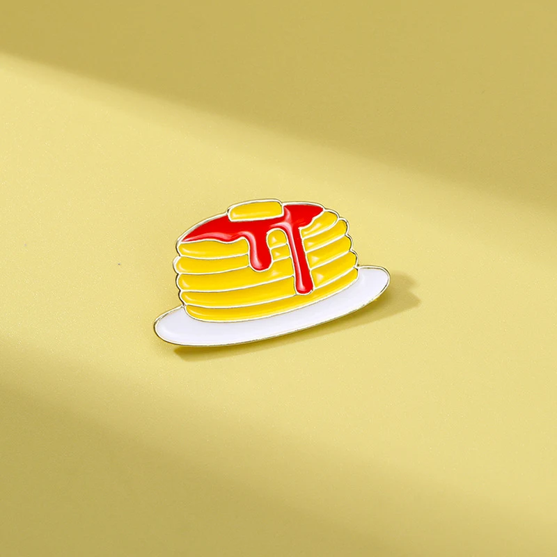 Broche fantaisie goutte d'huile de nourriture mignonne. Ajoutez une touche originale et amusante à vos tenues avec ce bijou de dessin animé.