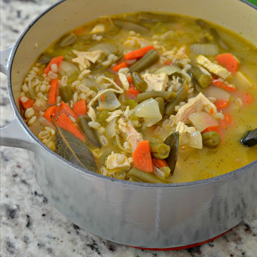 Easy and quick this delicious Chicken Barley Soup combines, onions, carrots, celery, garlic, green beans and chicken in a lightly seasoned broth.  Rotisserie chicken helps this soup come together in short order.