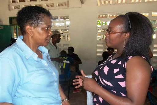 Kenya diabetic management executive director Eva Muchemi and Safaricom Foundation Trustee Josephine Ndambuki conversing at Jomo Kenyatta primary school in Msambweni Kwale on Saturday 31 January 2015 during a medical camp sponsored by Safaricom. Photo/ALLOYS MUSYOKA