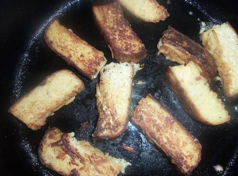 Kugelis Sliced Thin And Fried In Butter To Be Served With Breakfast.