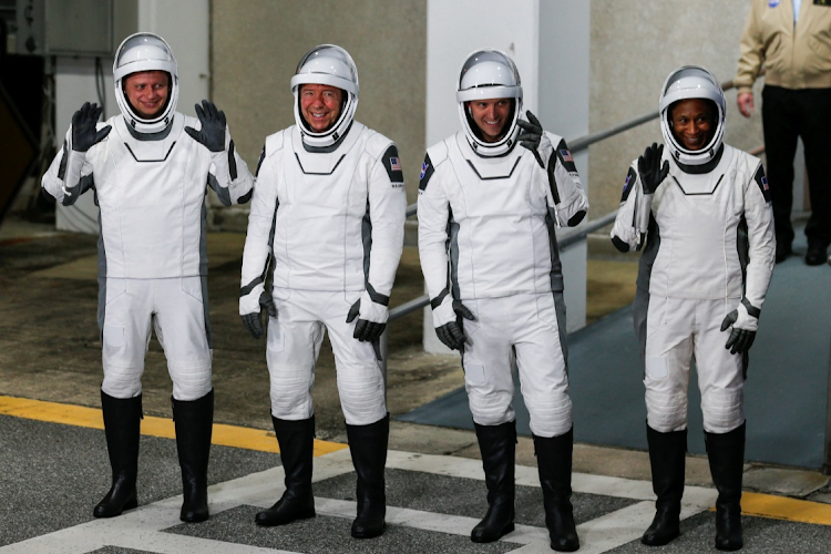 NASA's SpaceX Crew-8 astronauts Matthew Dominick, Michael Barratt, and Jeanette Epps, and Roscosmos cosmonaut Alexander Grebenkin, depart their crew quarters for the launch pad before their mission to the International Space Station, aboard a SpaceX Falcon 9 rocket from the Kennedy Space Center in Cape Canaveral, Florida, U.S., March 3, 2024.