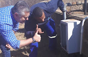 MMC for Environment and Infrastructure Nico de Jager and technicians give the thumbs. 