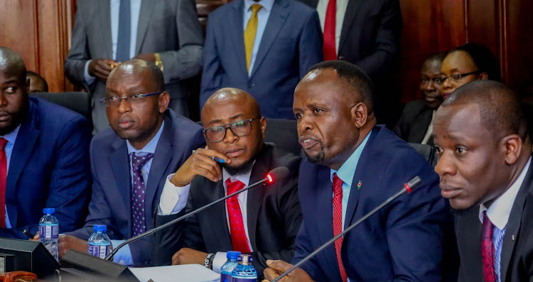 Transzoia Governor George Natembeya (second right) with other officials when he appeared before a Senate committee over his work-related differences with the deputy.