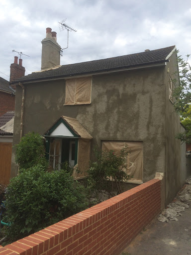 A sand, cement and unibond coat is applied to uniform surface and hold pebbledash together.