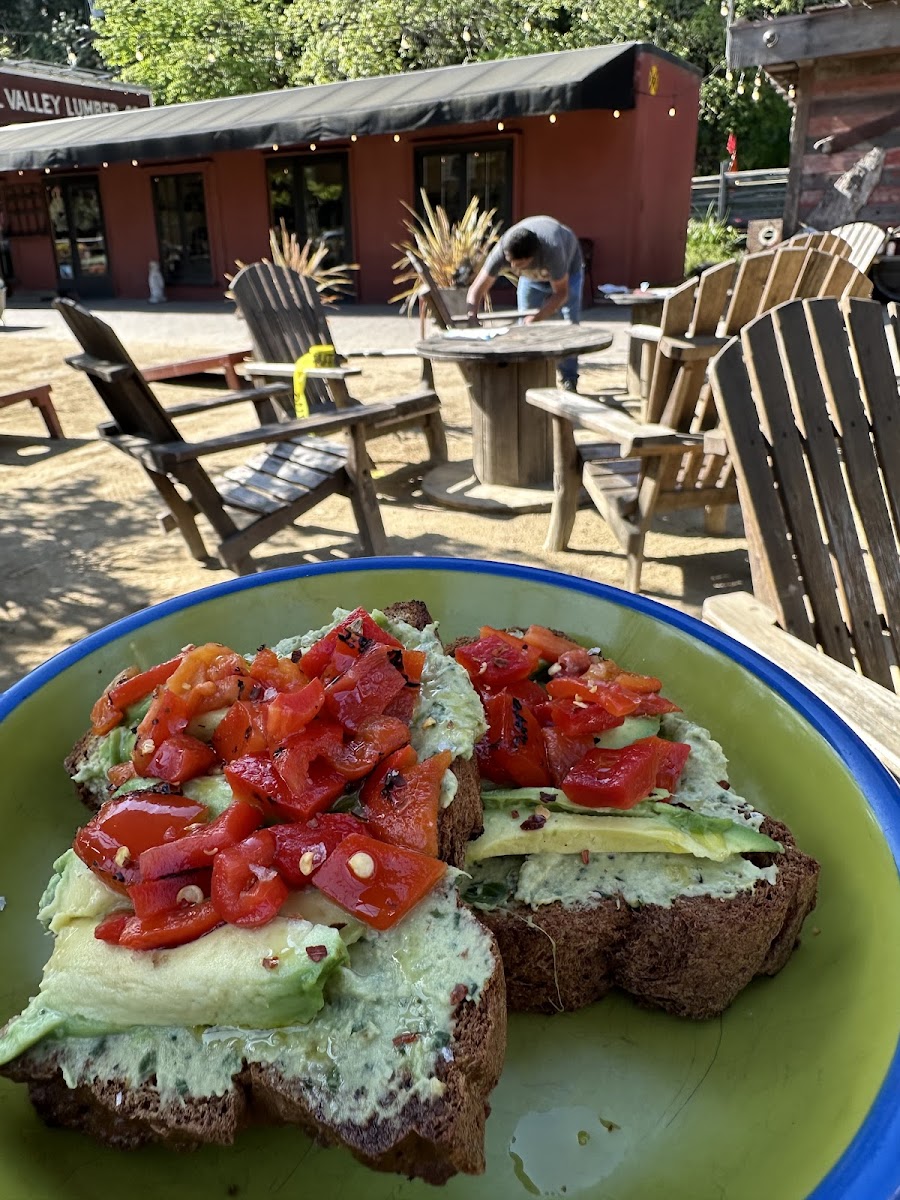 Jazzy avocado toast: Jalapeño-Cilantro Hummus, Avocado, Roasted Peppers, Olive Oil, Chili Flakes, Sea Salt on High Protein Bread. This was a large portion and very filling! Lovely outdoor seating area.