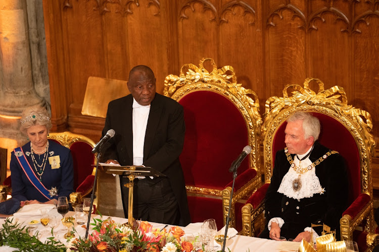 The Duchess of Gloucester (L) and Lord Mayor of London, Nicholas Lyons (R), listen as President of South Africa, Cyril Ramaphosa, makes a speech at the Guildhall on November 23, 2022 in London, England.