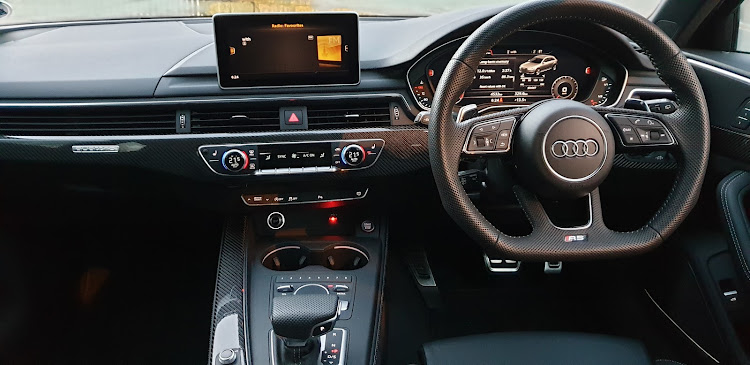 Flat-bottomed RS steering wheel and aluminium pedals set a racy interior scene.Picture: DENIS DROPPA