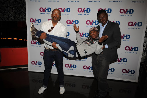 Trevor Gumbi, who plays Thomas Gumbi, Christopher Kubheka plays Skhumba and Bexta Ndabalime as Abimbola at the launch of hilarious local sitcom on eTV channel held in Paker's in Montecasino Fourways. Pic: Tsheko Kabasia. © Sunday World