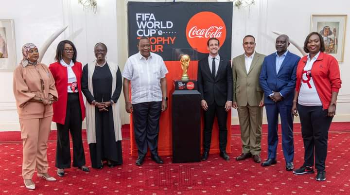 President Uhuru Kenyatta with Brazilian star Juliano Belletti and other officials with the FIFA World cup trophy at State House on Thursday, May 26, 2022.