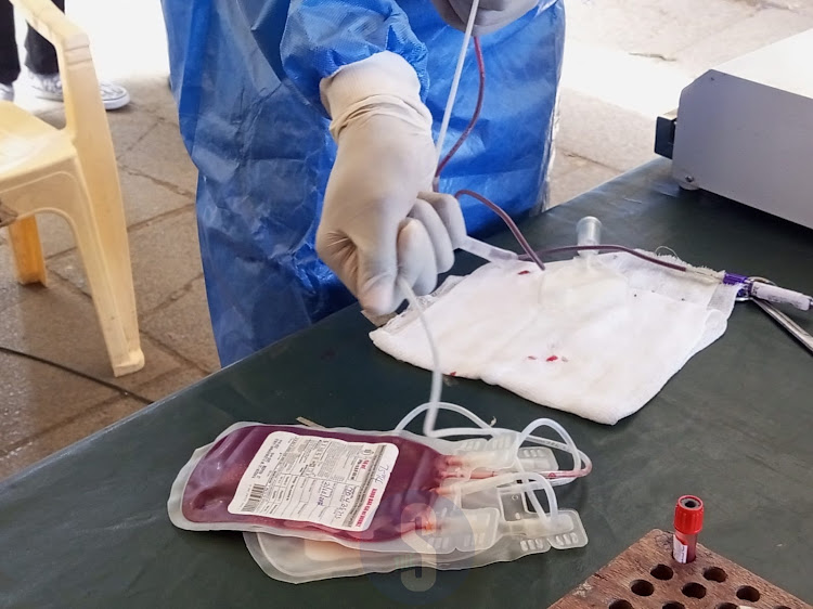 A nurse prepares blood for storage during a donation drive by the Kenya Tissue and Transplant Authority at Kencom on October 21, 2022