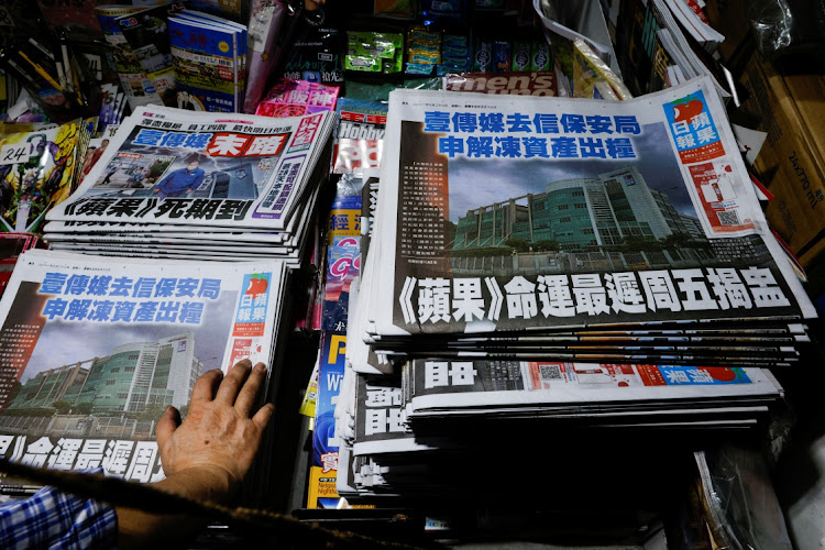 Copies of the Apple Daily newspaper are seen at a newspaper stall after it looked set to close for good following police raids and the arrest of executives in Hong Kong on June 22 2021.