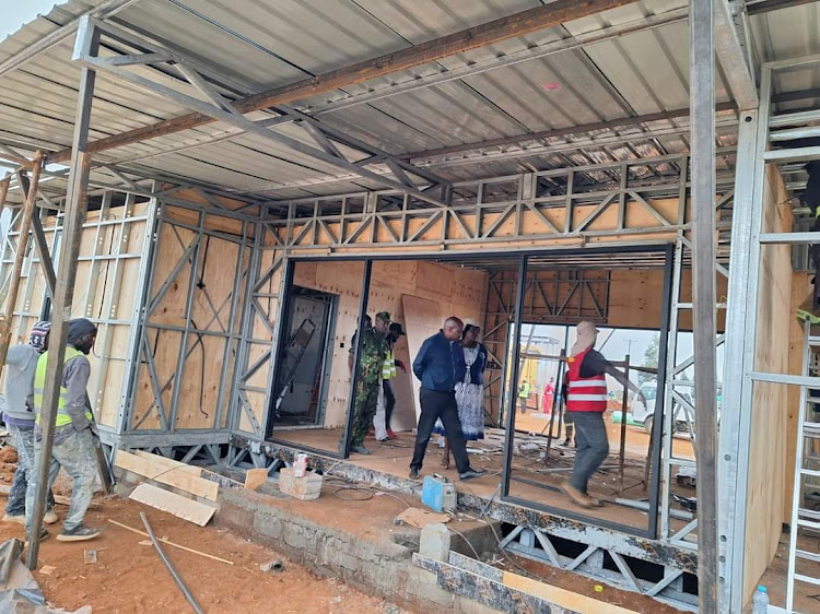 Workers at the site where Kiptum's house is being constructed at Naiberi in Uasin Gishu county on February 20, 2024