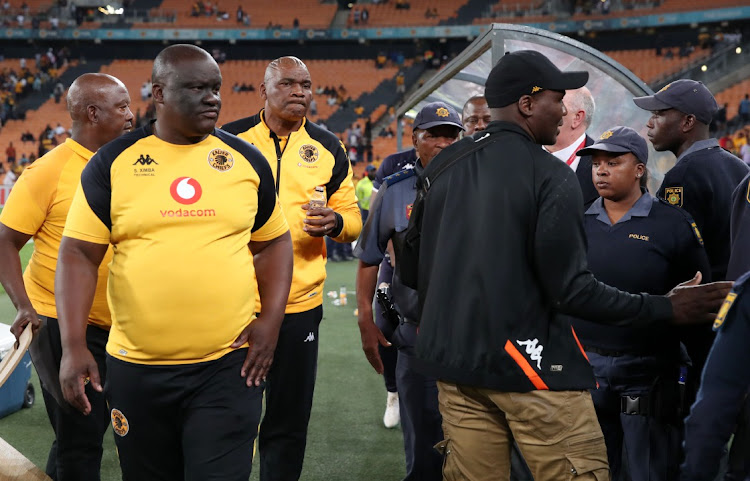 Scked Kaizer Chiefs coach Ntseki Molefi escorted by police during the 2023 Carling Black Label Knockout match against AmaZulu at the FNB Stadium on 21 October 2023.