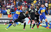 Happy Jele of Orlando Pirates challenged by Roland Putsche of Cape Town City during the 2018 Nedbank Cup Last 16 football Match between Cape Town City FC and Orlando Pirates at Cape Town Stadium in Cape Town on 14 March 2018. 
