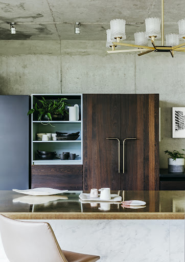 The striking brass cupboard handles are custom designs by homeowner Lisa Twyman.