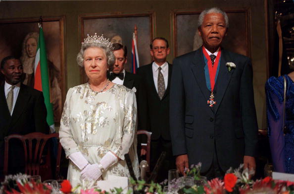 The Queen at a banquet with former president Nelson Mandela in Cape Town, South Africa. Picture: GETTY IMAGES/TIM GRAHAM