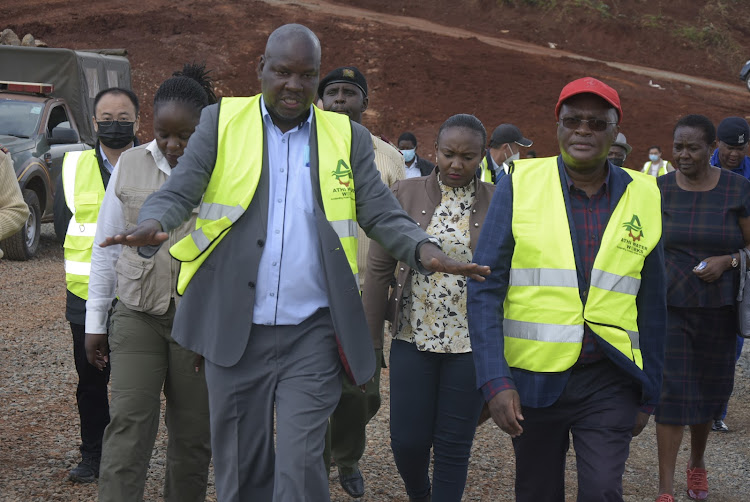 A file image of Athi Water Services Board CEO Michael Thuita (L) and then acting Water Cabinet Secretary James Macharia during a tour of Kariminu II Dam in Gatundu North.